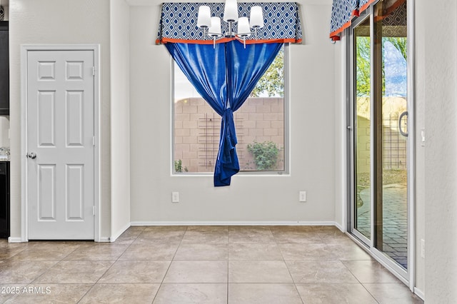 unfurnished dining area with light tile patterned flooring and a chandelier