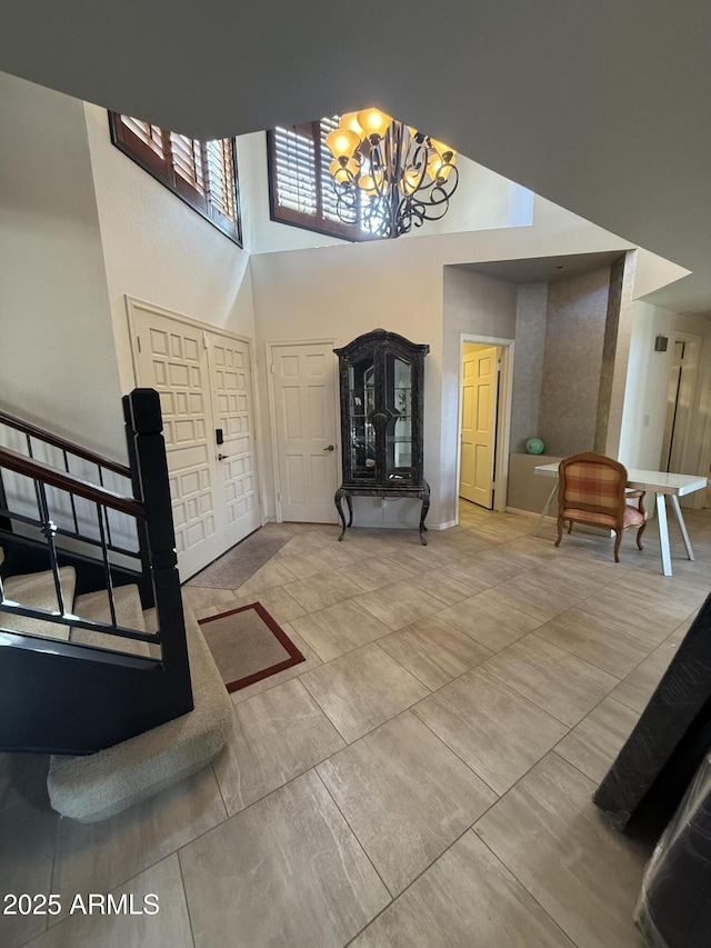 entrance foyer with a high ceiling and an inviting chandelier