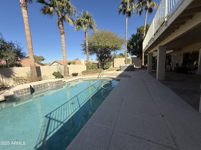 view of pool featuring a fenced in pool, a patio area, and a fenced backyard