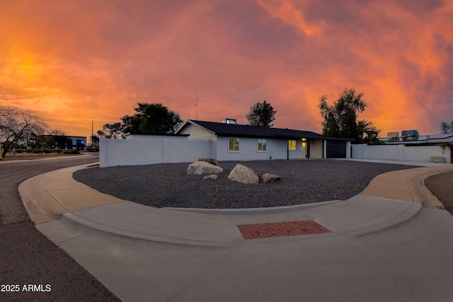 view of front of property featuring fence