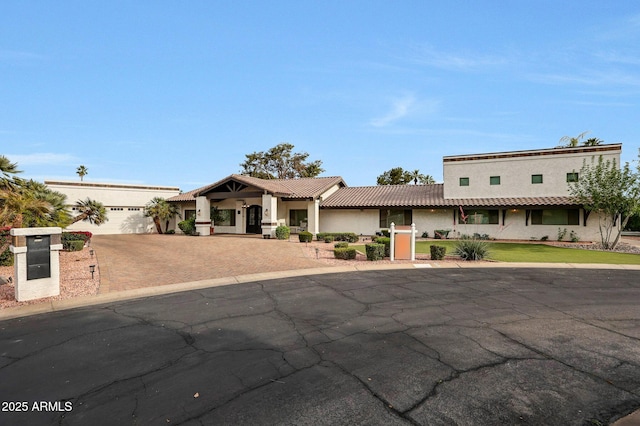 1153 N Oro Vis, Litchfield Park, AZ 85340 - view of front of property featuring decorative driveway, stucco siding, and a tile roof
