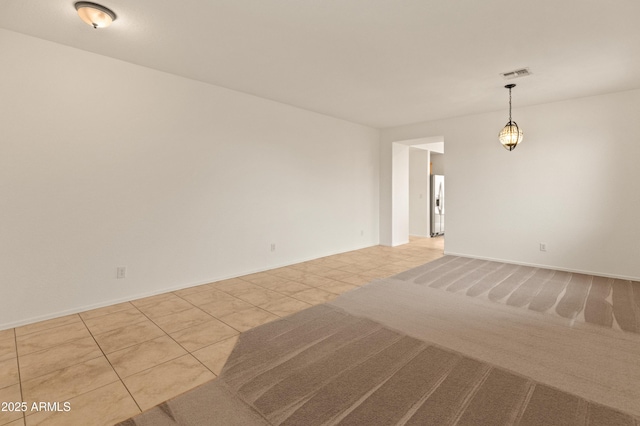 39609 N White Tail Ln, Anthem, AZ 85086 - unfurnished room featuring baseboards, visible vents, and tile patterned flooring