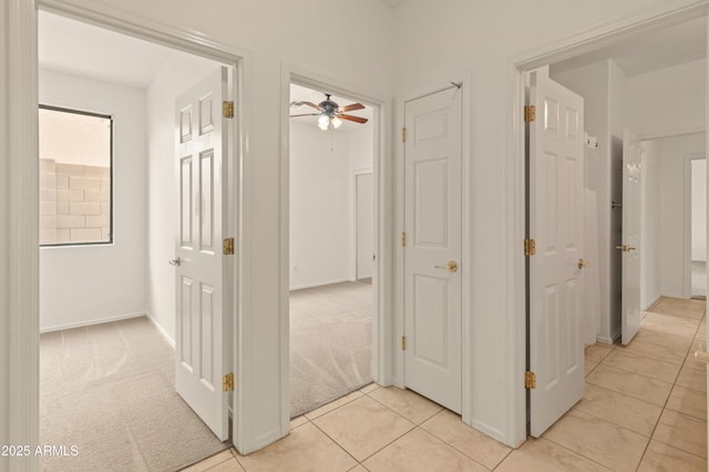 39609 N White Tail Ln, Anthem, AZ 85086 - corridor featuring baseboards and light tile patterned floors
