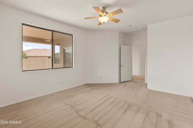 39609 N White Tail Ln, Anthem, AZ 85086 - spare room with carpet, visible vents, a ceiling fan, and baseboards