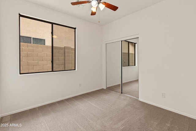 39609 N White Tail Ln, Anthem, AZ 85086 - unfurnished bedroom featuring baseboards, carpet, a closet, and ceiling fan