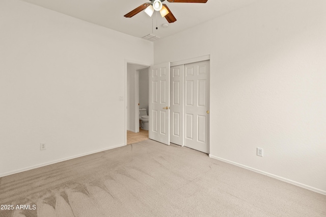 39609 N White Tail Ln, Anthem, AZ 85086 - unfurnished bedroom featuring ceiling fan, baseboards, carpet flooring, and a closet