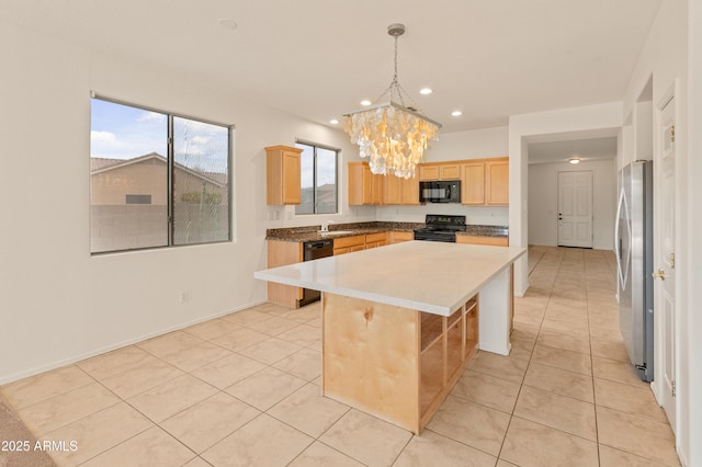 39609 N White Tail Ln, Anthem, AZ 85086 - kitchen featuring light brown cabinetry, a sink, light tile patterned floors, black appliances, and a notable chandelier