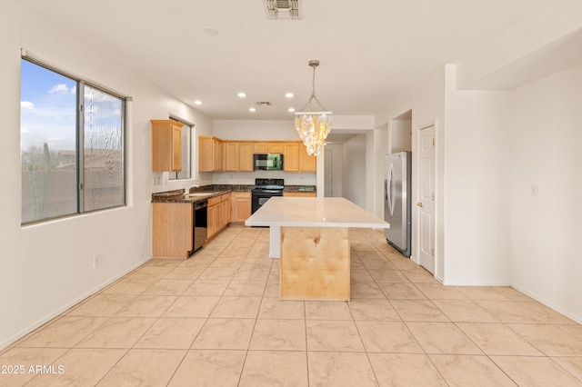 39609 N White Tail Ln, Anthem, AZ 85086 - kitchen with recessed lighting, visible vents, light brown cabinets, black appliances, and a chandelier