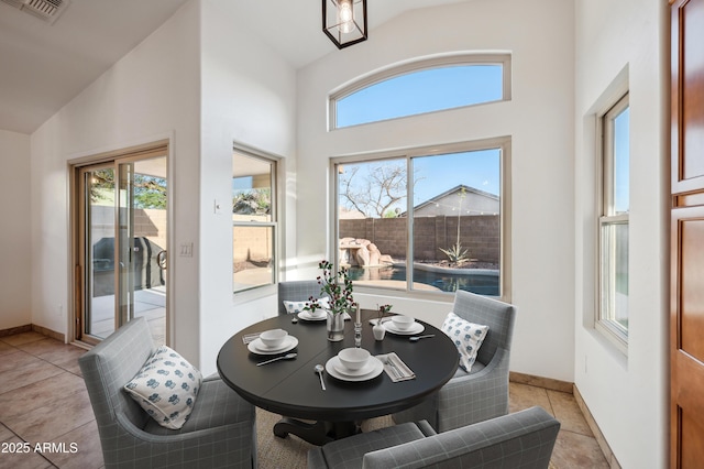 6309 W Hughes Dr, Phoenix, AZ 85043 - dining room with high vaulted ceiling and baseboards