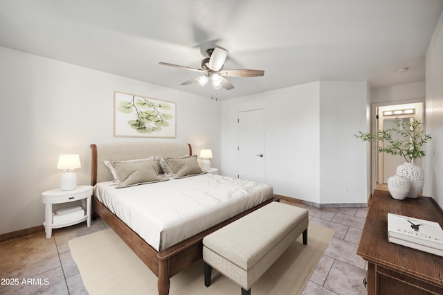 6309 W Hughes Dr, Phoenix, AZ 85043 - bedroom with baseboards, light tile patterned floors, and ceiling fan