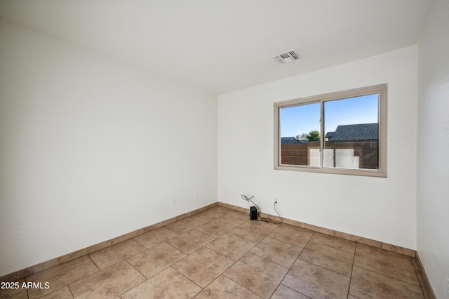 6309 W Hughes Dr, Phoenix, AZ 85043 - spare room with baseboards and light tile patterned floors