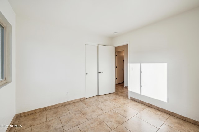 6309 W Hughes Dr, Phoenix, AZ 85043 - spare room with light tile patterned floors