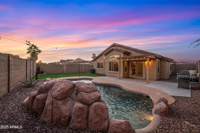 6309 W Hughes Dr, Phoenix, AZ 85043 - back of house featuring a patio area, a fenced backyard, and central air condition unit