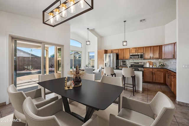 6309 W Hughes Dr, Phoenix, AZ 85043 - tiled dining space with high vaulted ceiling
