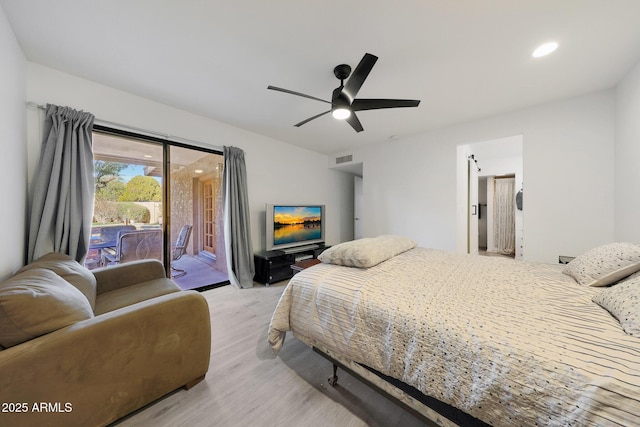 bedroom featuring access to exterior, ceiling fan, and light wood-type flooring