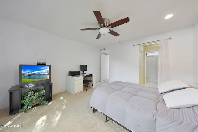 bedroom featuring ceiling fan and light carpet