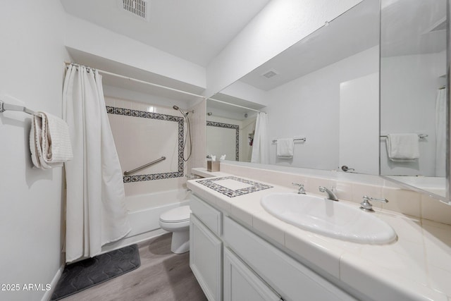 full bathroom featuring shower / bath combination with curtain, vanity, toilet, and hardwood / wood-style flooring