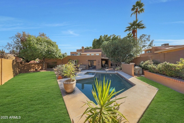 view of swimming pool featuring a yard and a patio