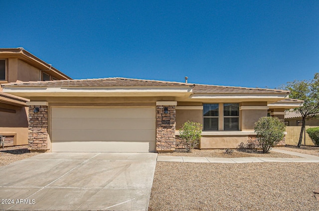 prairie-style house featuring a garage