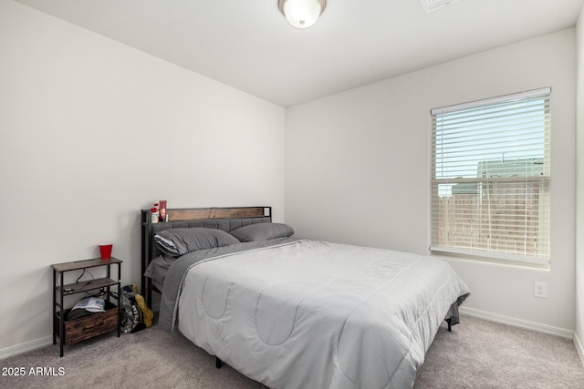 bedroom with light colored carpet