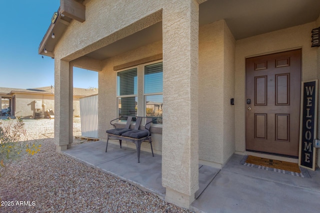 doorway to property with a patio area