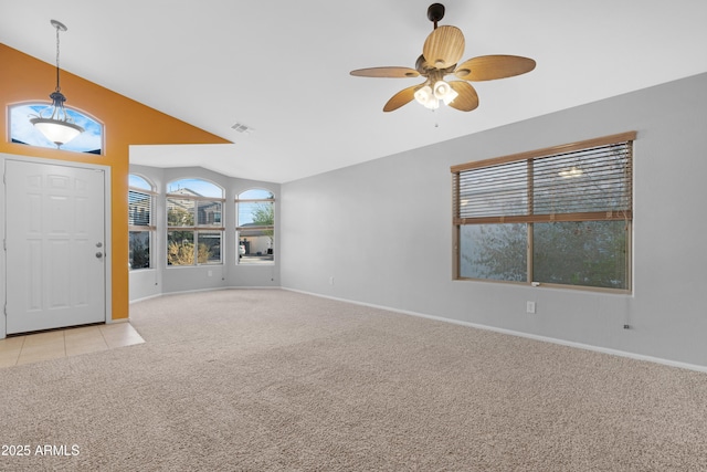 entryway featuring visible vents, light carpet, lofted ceiling, a ceiling fan, and baseboards