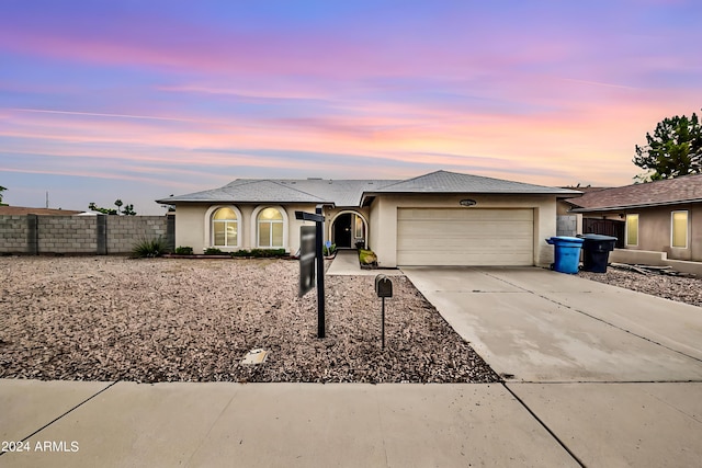 ranch-style house featuring a garage