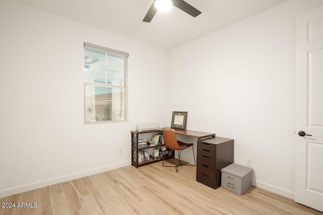 home office with ceiling fan and light hardwood / wood-style floors