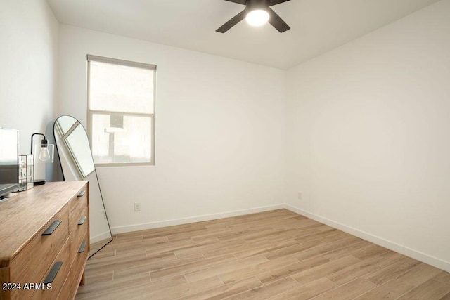 interior space with ceiling fan and light hardwood / wood-style flooring