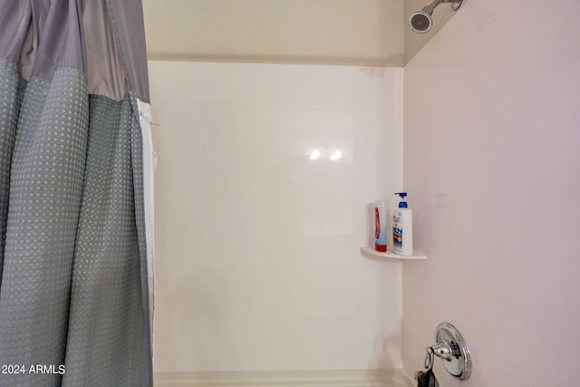 bathroom featuring shower / bath combination with curtain