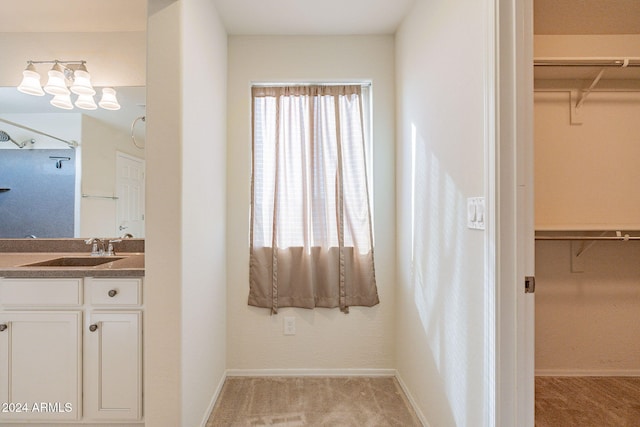 bathroom with plenty of natural light and vanity