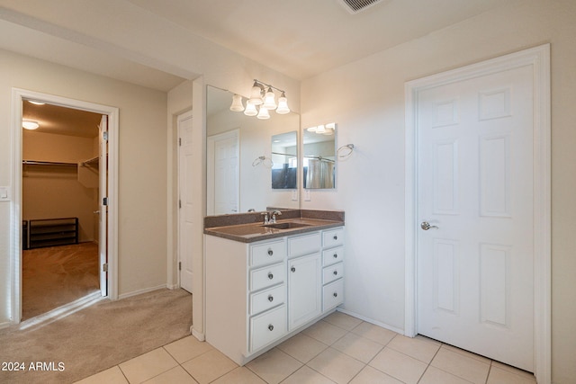 bathroom featuring vanity and tile patterned flooring