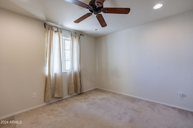 carpeted empty room with ceiling fan