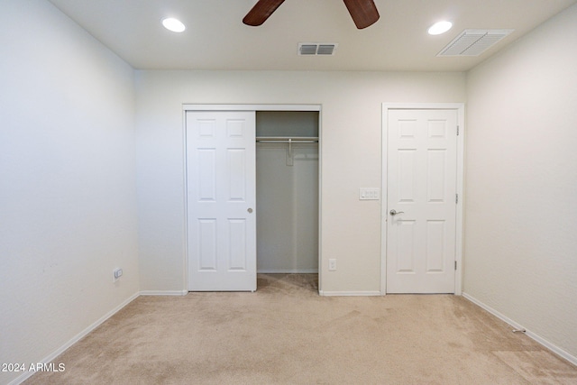 unfurnished bedroom with ceiling fan and light carpet