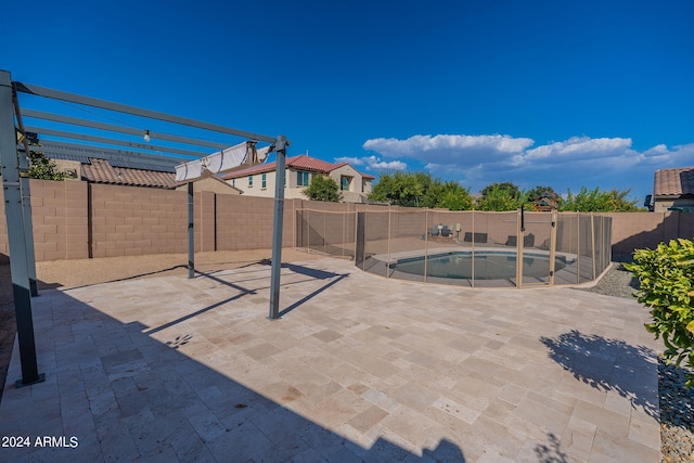 view of patio with a pergola and a fenced in pool