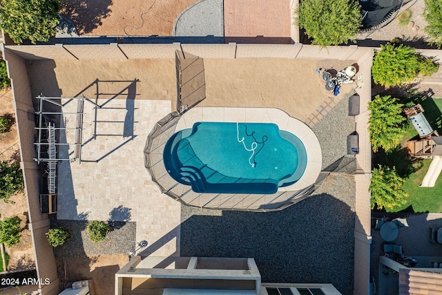 view of swimming pool with a patio area