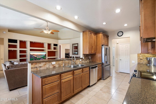3350 E Rosemonte Dr, Phoenix, AZ 85050 - kitchen with stainless steel appliances, a sink, a peninsula, open floor plan, and backsplash