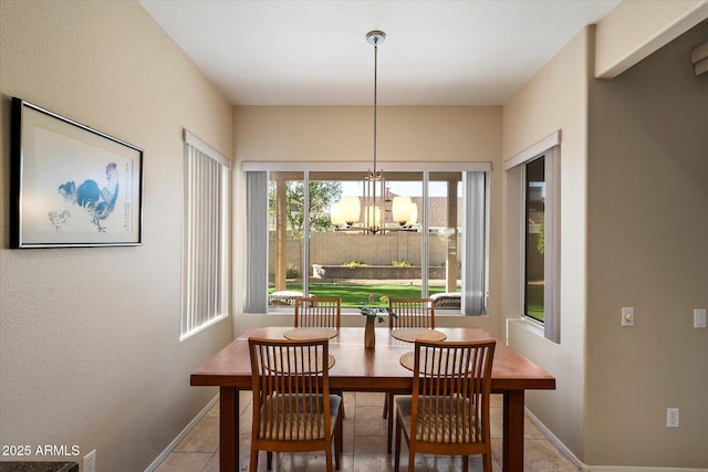 3350 E Rosemonte Dr, Phoenix, AZ 85050 - tiled dining room featuring baseboards and a chandelier