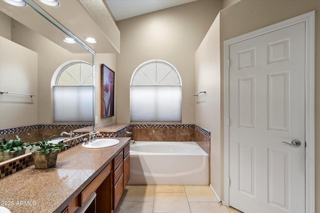 3350 E Rosemonte Dr, Phoenix, AZ 85050 - bathroom with tile patterned flooring, a bath, vanity, and recessed lighting