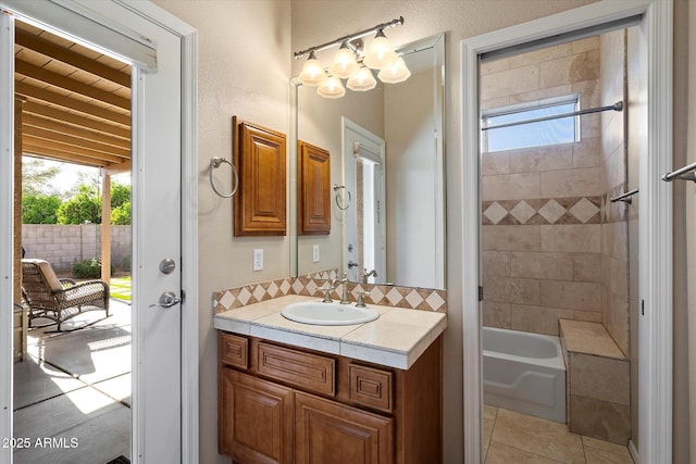 3350 E Rosemonte Dr, Phoenix, AZ 85050 - full bathroom with vanity, bathing tub / shower combination, tile patterned floors, backsplash, and a chandelier