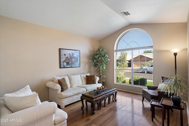 3350 E Rosemonte Dr, Phoenix, AZ 85050 - living room with wood finished floors, lofted ceiling, and baseboards