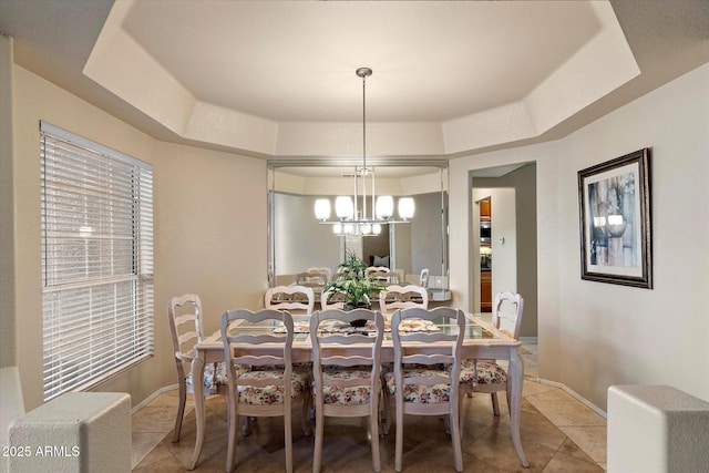 3350 E Rosemonte Dr, Phoenix, AZ 85050 - dining space featuring a chandelier, baseboards, light tile patterned flooring, and a tray ceiling