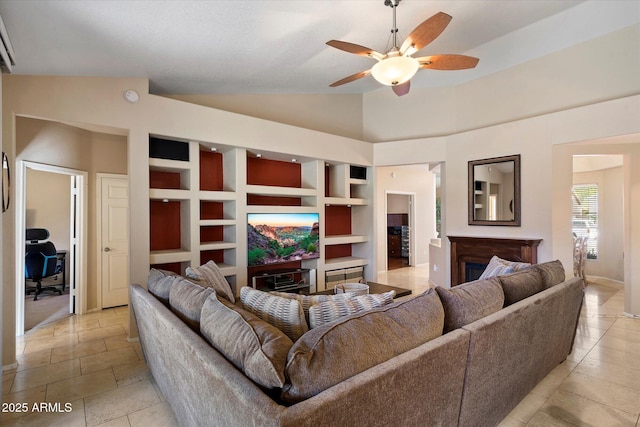 3350 E Rosemonte Dr, Phoenix, AZ 85050 - living area featuring a ceiling fan, built in features, a fireplace, and lofted ceiling