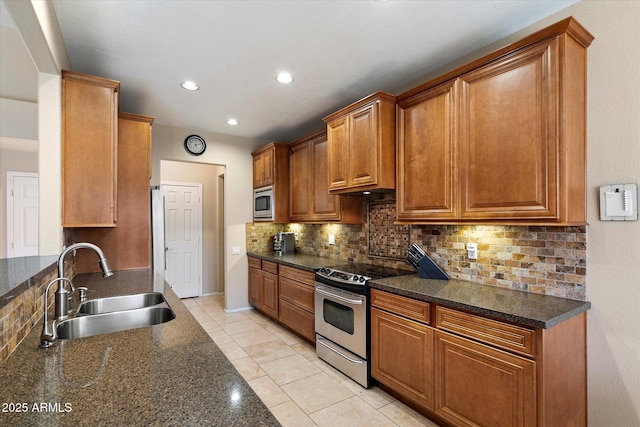 3350 E Rosemonte Dr, Phoenix, AZ 85050 - kitchen featuring stainless steel appliances, a sink, backsplash, brown cabinetry, and recessed lighting
