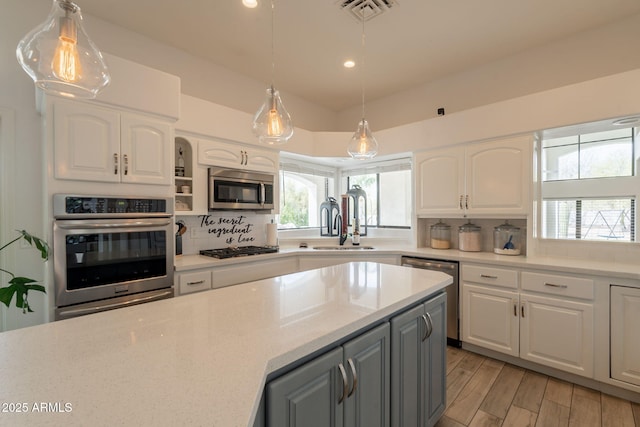 8502 E Santa Catalina Dr, Scottsdale, AZ 85255 - kitchen with stainless steel appliances, white cabinetry, decorative backsplash, recessed lighting, and gray cabinets
