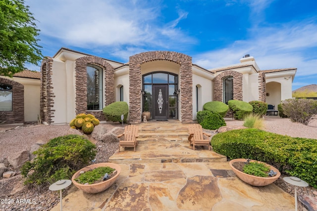 8502 E Santa Catalina Dr, Scottsdale, AZ 85255 - view of front of home featuring stucco siding, french doors, and a chimney