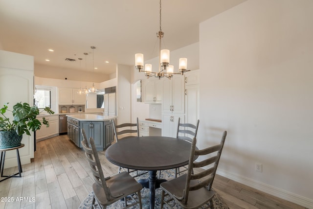 8502 E Santa Catalina Dr, Scottsdale, AZ 85255 - dining area featuring a chandelier, light wood-style flooring, baseboards, and recessed lighting