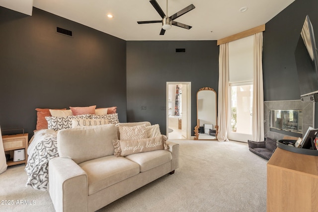 8502 E Santa Catalina Dr, Scottsdale, AZ 85255 - carpeted bedroom with recessed lighting, ensuite bathroom, a tiled fireplace, and ceiling fan