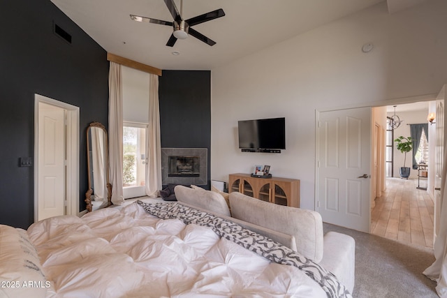 8502 E Santa Catalina Dr, Scottsdale, AZ 85255 - bedroom featuring high vaulted ceiling, a tile fireplace, carpet floors, and a ceiling fan