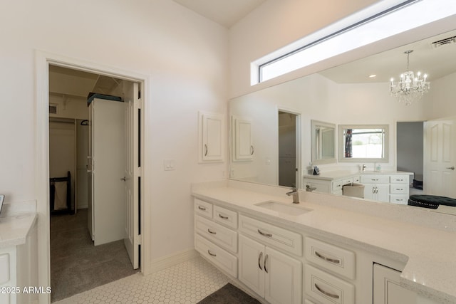8502 E Santa Catalina Dr, Scottsdale, AZ 85255 - bathroom with a chandelier, healthy amount of natural light, vanity, and tile patterned floors